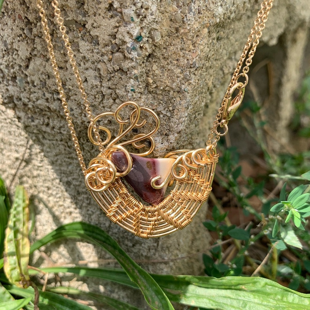 Mookite hand wire wrapped in gold plated copper wire.